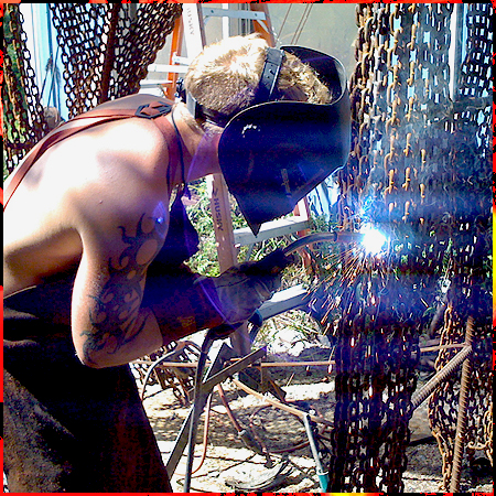 Ivan welding giraffe chain leg