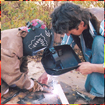 Al helping a child weld